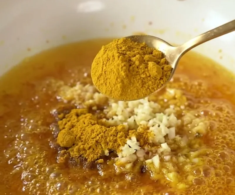 Bloom the curry powder in hot oil