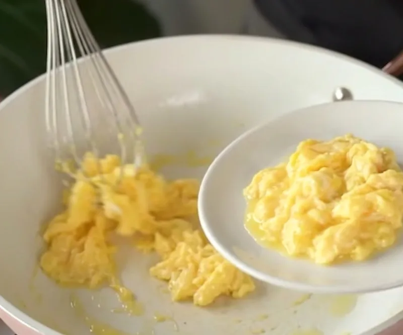 Scramble the egg first, then set it aside